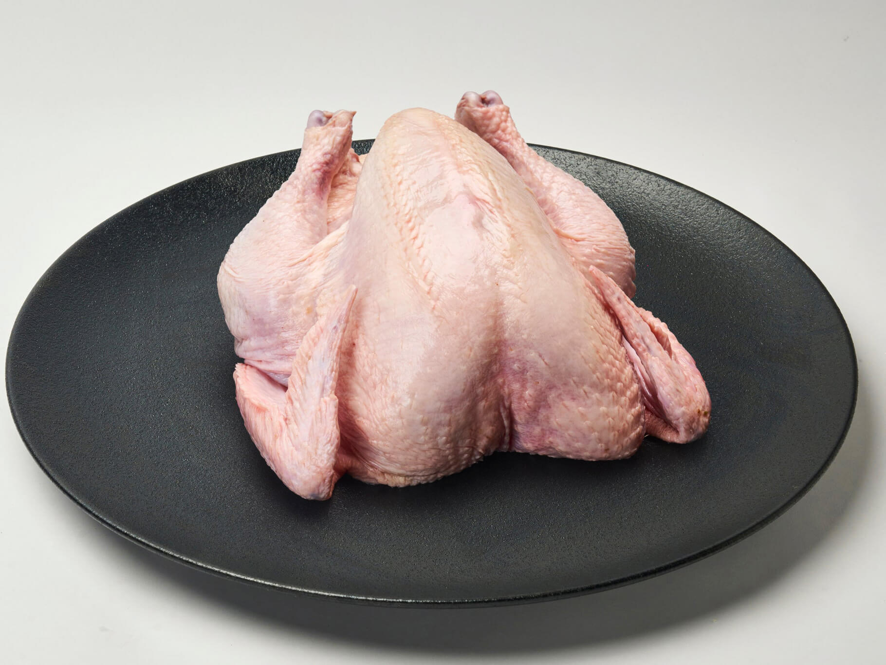 Whole farm fresh chicken ready for roasting